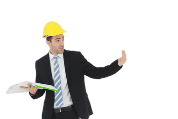 Handsome and smart engineer in black suit Wearing a yellow safety engineer hat with hand holding Construction drawing papers and serious in work isolated on yellow background. Copy Space