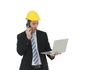 Handsome engineer in suit and white shirt and Wearing a yellow safety engineering hat with hand holding laptop and smartphone speaking and working in project isolated on White background.