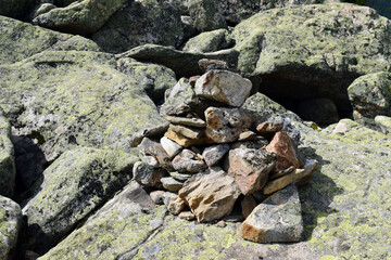 High mountains of unusual shape. Ergaki nature Park. East Sayan ridge. Beautiful nature of Siberia. Tall pines and firs. Mountain landscape. Blue sky. Hard rock.