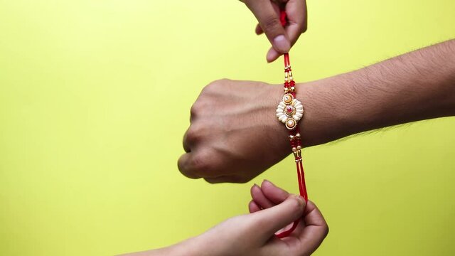 Tying rakhi for raksha bandhan festival india stock image.