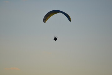 paragliding with summer sun starting to set