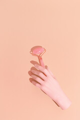 Face care concept art. Minimal still life design. .Massage quartz roller