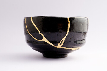 Antique raku Japanese kintsugi bowl, restored with gold.
Antique traditional handmade pottery.