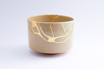 Antique Beige Japanese kintsugi bowl, restored with gold.
Antique traditional handmade pottery.