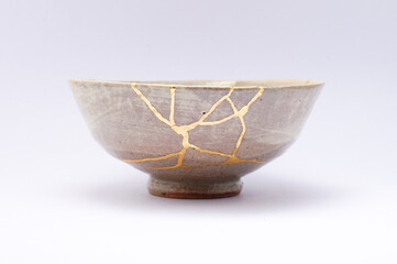 Antique Beige Japanese kintsugi bowl, restored with gold.
Antique traditional handmade pottery.