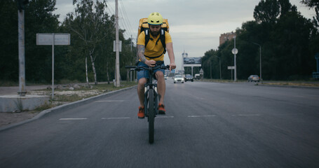 Bicycle messenger smiling at camera