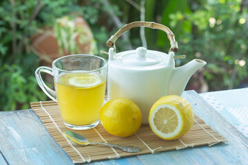 Hot tea cup with lemon and Teapot