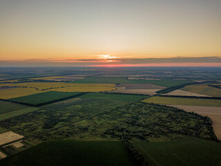 Sunset over the agricultural fields of Ukraine. Aerial drone view.