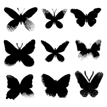 Grunge butterflies silhouettes on white background. Vector set