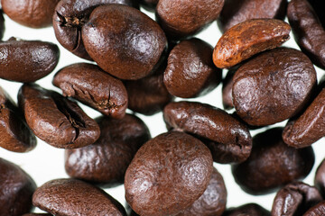 Coffee grains on white background