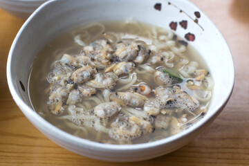 Korean food seafood noodle Soup with clams.