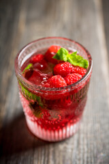 Old fashioned raspberry cocktail. Selective focus. Shallow depth of field.