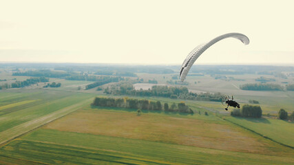 Paramotor Tandem Gliding And Flying In The Air. Copy space. High quality photo