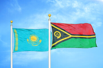 Kazakhstan and Vanuatu two flags on flagpoles and blue sky