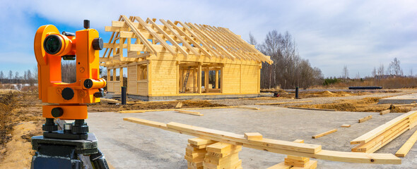 Theodolite. Panorama of the construction site. Geodetic surveys during construction. Theodelite is...