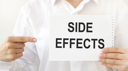 Dr. Derdit has a notepad that says Side effects. We point at him with a pointing. Medical concept.
