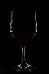 Wine glass on a black background with a white outline