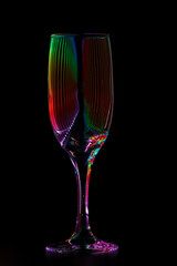 champagne glass with reflection of colored rays of light