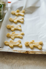 Making of gingerbread man on the kitchen. Selective focus.