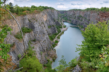Panorama of big Amerika quarry in summer with cloudy sky, Czech Republic
