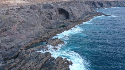 mighty ocean spitting out the cliffs