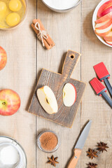 Top view raw ingredients for cooking apple pie on wooden background. Bakery background.
