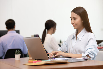 Business asian woman happy working job on laptop in office.