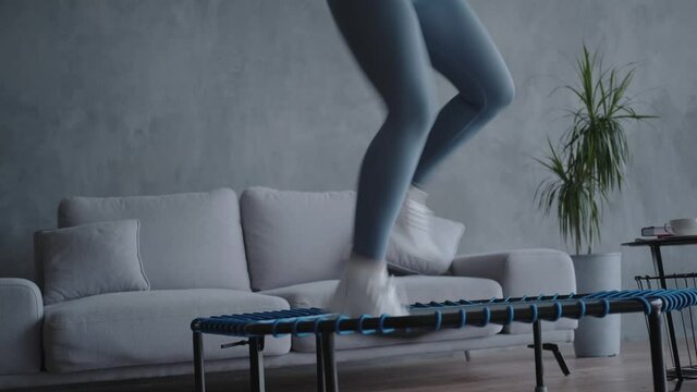 A woman trains in an apartment alone, Home Workout