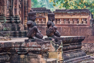statues of human figures with animal heads in Banteay Srei temple in  the area of Angkor, Cambodia