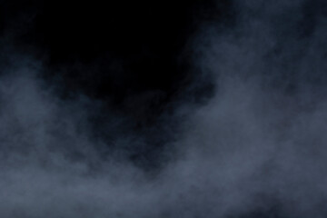 Grey smoke on a black background, fog on a dark background