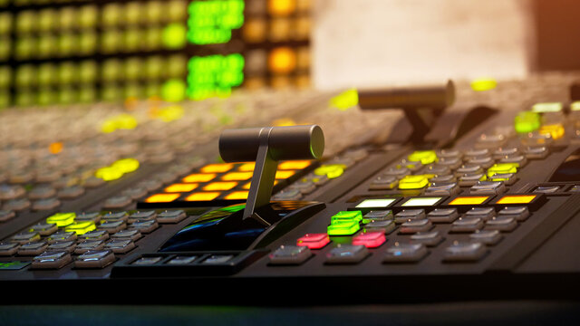 Blur image video switch of Television Broadcast, working with video and audio mixer, control broadcasts in recording studio. Broadcasting in the studio, professional mixing sender color buttons.
