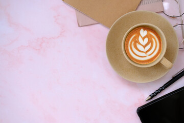 cup of coffee and coffee latte on table background