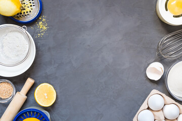 Top view raw ingredients for cooking lemon pie on wooden background with copy space. Bakery background.