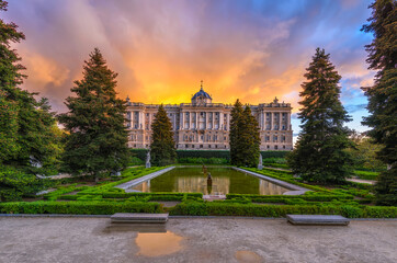 Sunset view of Royal Palace of Madrid and Sabatini park in Madrid, Spain