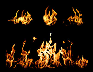 Collection of bright fire flames on black background