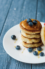 Homemade pancakes and jungle fruit in the background