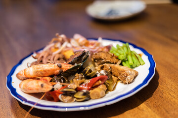 eat plate of seafood on table