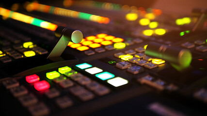 Blur image video switch of Television Broadcast, working with video and audio mixer, control broadcasts in recording studio. Broadcasting in the studio, professional mixing sender color buttons.