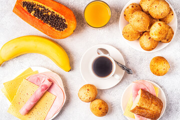 Traditional Brazilian breakfast - cheese bread, coffee, ripe fruit.