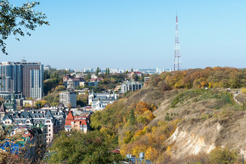 Autumn view of a part of Castle Hill in Kiev, the urban landscape of Podil and Obolon in the background against the blue sky