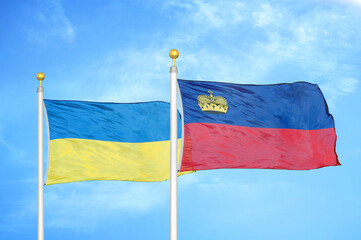 Ukraine and Liechtenstein two flags on flagpoles and blue sky