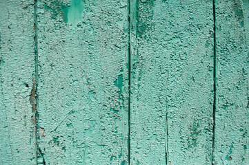 Green peeling background, wall with green, peeled paint