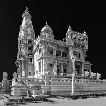 Black and white Angle view of rear facade of Baron Empain Palace, a historic mansion inspired by the Cambodian Hindu temple of Angkor Wat, located in Heliopolis district, Cairo, Egypt