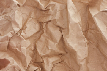 Obraz premium brown recycled crumpled paper background: crush fold texture backgrounds for design, decorative. paper texture concept.