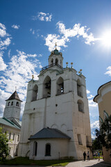 Fototapeta premium white stone old buildings with golden domes against the blue sky