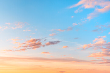 Fototapeta premium Sunset sky with clouds and red reflections from the sun. Bright colorful background