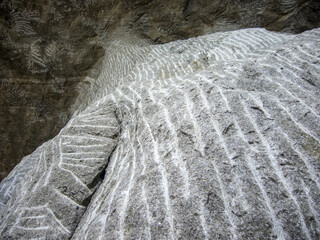 salt wall with exploitation marks in salt mine 