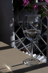 still life with a glass of white wine and external reflections