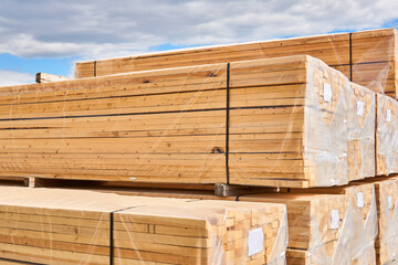 new wooden boards are packed for loading to the buyer in the open air