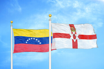 Venezuela and Northern Ireland two flags on flagpoles and blue sky